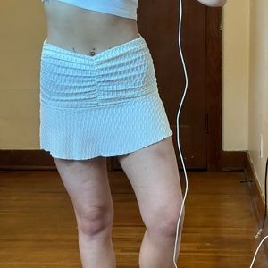 White ruffle mini skirt